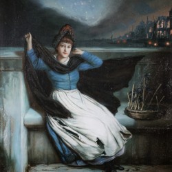 A woman in a blue dress at the edge of a city